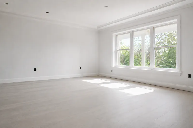 The same room after a post-construction clean: dust-free floors and clear windows